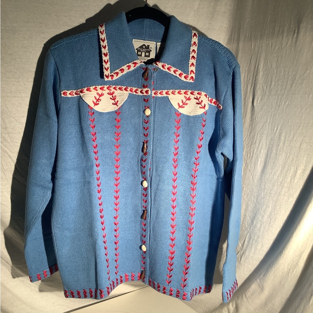 Storybook knit sweater titled “American Game”